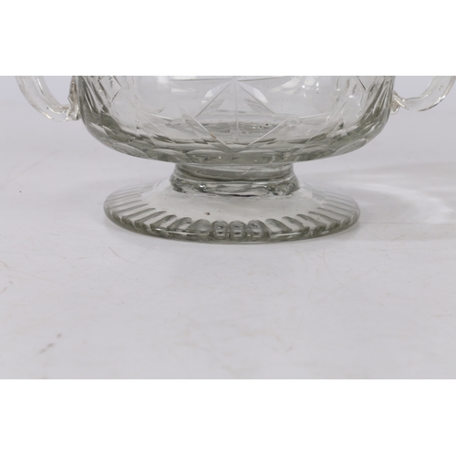 261 - A MID 18TH CENTURY BOHEMIAN CUT GLASS DISH. Circa 1740, having twin handles above a star and circle ... 