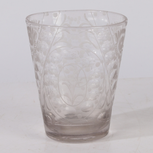 263 - A MID 18TH CENTURY BOHEMIAN ENGRAVED BEAKER. Circa 1740, engraved with floral patterns, 12cm high.