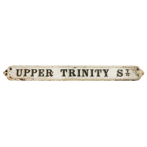 274 - A VICTORIAN SCROLL CAST IRON STREET SIGN 'UPPER TRINITY STREET'. of rectangular form, painted in whi... 