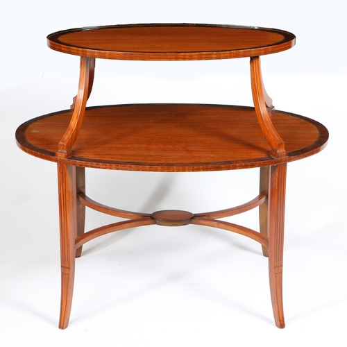 3 - A VICTORIAN SATINWOOD AND MAHOGANY TWO TIER ETAGERE. Having two satinwood oval platforms with mahoga... 