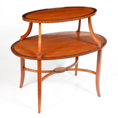 3 - A VICTORIAN SATINWOOD AND MAHOGANY TWO TIER ETAGERE. Having two satinwood oval platforms with mahoga... 