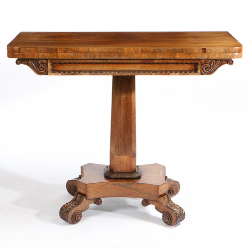 60 - A WILLIAM IV ROSEWOOD TEA TABLE. having a swivel fold over top, above an acanthus leaf and beaded fr... 