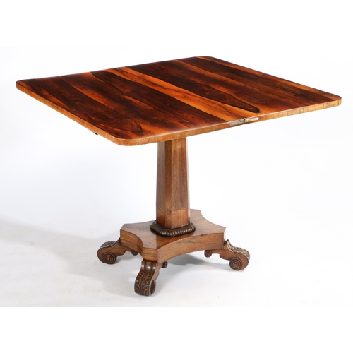 60 - A WILLIAM IV ROSEWOOD TEA TABLE. having a swivel fold over top, above an acanthus leaf and beaded fr... 