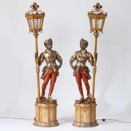 66 - A PAIR OF 20TH CENTURY BLACKAMOOR FLOOR LAMPS. resin figures mounted on plinth bases holding a lante... 