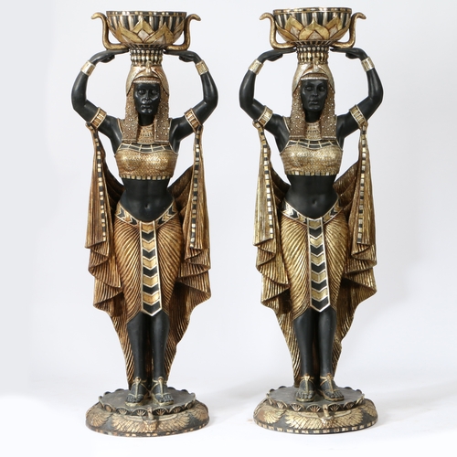 67 - A PAIR OF FLOOR STANDING PLANTERS MODELLED AS CLEOPATRA'S EGYPTIAN NUBIAN MAIDENS. life size resin f... 