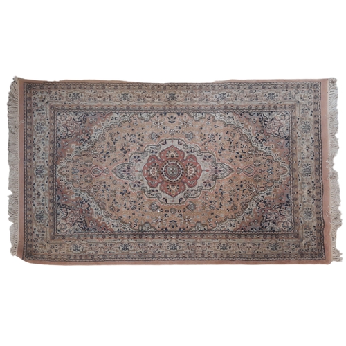 72 - TWO SMALL PERSIAN RUGS. mid to late 20th century, one having a cream ground set with a central main ... 