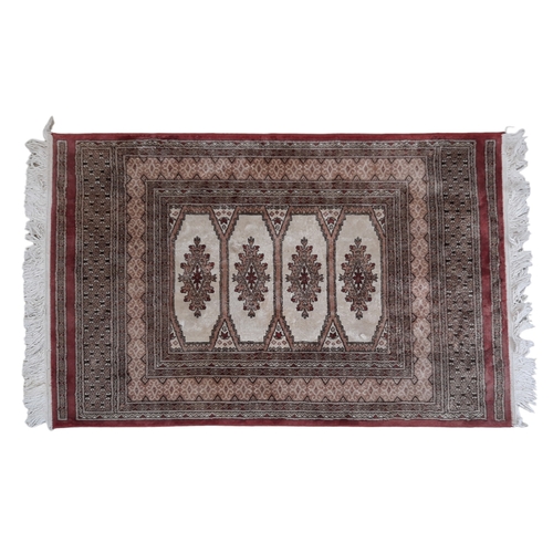 72 - TWO SMALL PERSIAN RUGS. mid to late 20th century, one having a cream ground set with a central main ... 