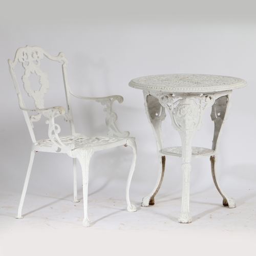 75 - A LATE 19TH/EARLY 20TH CENTURY CAST IRON TABLE TOGETHER WITH AN ALUMINUM ARMCHAIR. both being painte... 