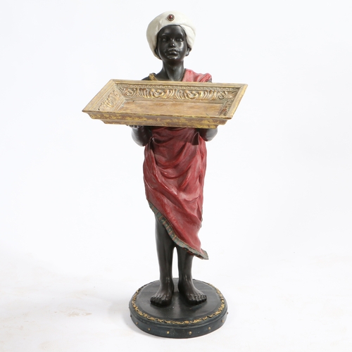 76 - A 20TH CENTURY BLACKAMOOR FIGURE HOLDING FRUIT TRAY. depicting a figure wearing a red garment and ho... 
