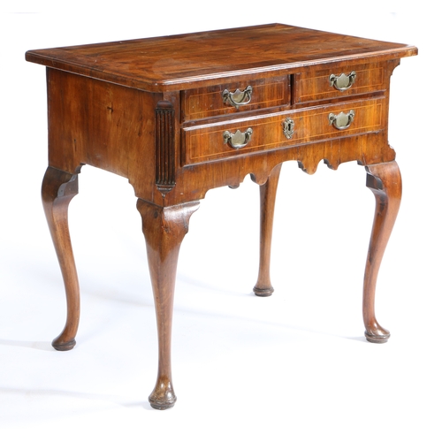 78 - A GEORGE III WALNUT LOWBOY. having a rectangular top formed into four sections divided by boxwood in... 