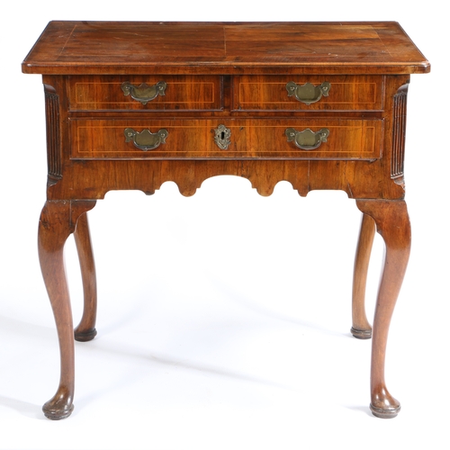 78 - A GEORGE III WALNUT LOWBOY. having a rectangular top formed into four sections divided by boxwood in... 