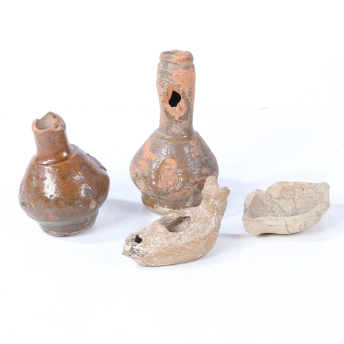 13 - A BYZANTINE POTTYER OIL LAMP, CIRCA 6TH - 8TH CENTURY AD. Together with a Holy Land oil lamp and two... 