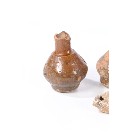 13 - A BYZANTINE POTTYER OIL LAMP, CIRCA 6TH - 8TH CENTURY AD. Together with a Holy Land oil lamp and two... 