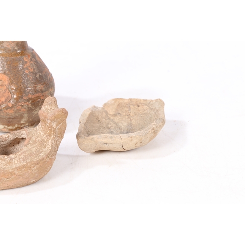 13 - A BYZANTINE POTTYER OIL LAMP, CIRCA 6TH - 8TH CENTURY AD. Together with a Holy Land oil lamp and two... 