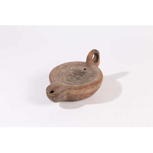 2 - A RARE OVERSIZED ROMAN OIL LAMP, 3RD CENTURY A.D. With the head of a Satyr to the centre and a loop ... 