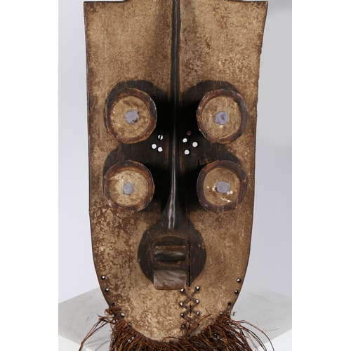 32 - A DAN KRAN HORNBILL MASK, LIBERIA. first half of the 20th century, having a raised forehead with a b... 