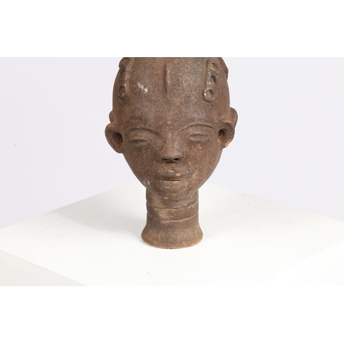 51 - AN AKAN NSODI CLAY POTTERY DOUBLE SIDED HEAD, GHANA. each face having ring decoration to the forehea... 