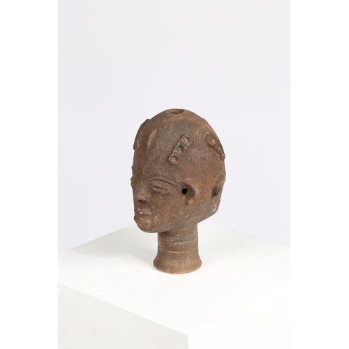 51 - AN AKAN NSODI CLAY POTTERY DOUBLE SIDED HEAD, GHANA. each face having ring decoration to the forehea... 