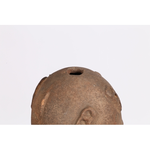 51 - AN AKAN NSODI CLAY POTTERY DOUBLE SIDED HEAD, GHANA. each face having ring decoration to the forehea... 