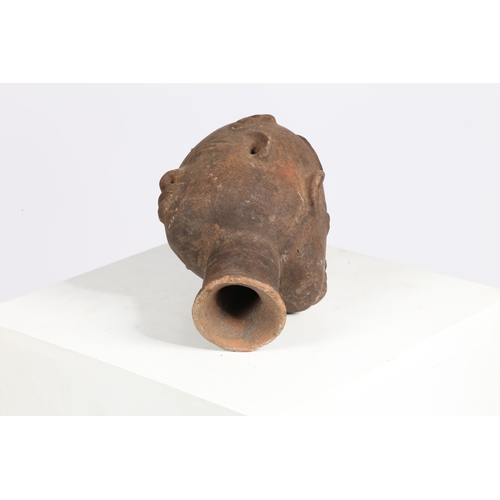 51 - AN AKAN NSODI CLAY POTTERY DOUBLE SIDED HEAD, GHANA. each face having ring decoration to the forehea... 