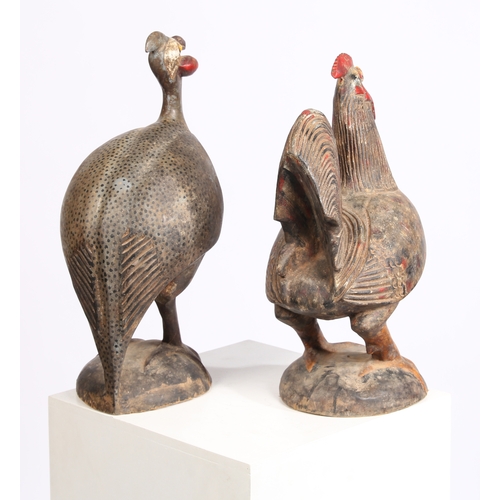 59 - TWO AFRICAN CARVED BIRDS. mid 20th century, to include a carved Cockerel probably Cameroon and a Cra... 