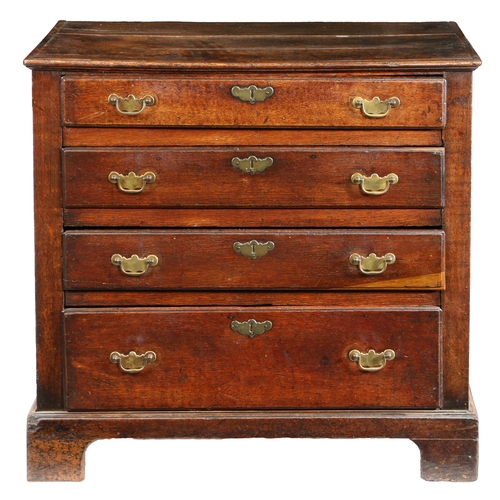 12 - A GEORGE III OAK CHEST OF DRAWERS, CIRCA 1800. The rectangular top above four long graduated drawers... 