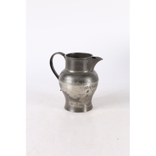 123 - A GEORGE III PEWTER QUART ALE JUG, CIRCA 1800. The body of ovoid form, with tall cylindrical collar ... 