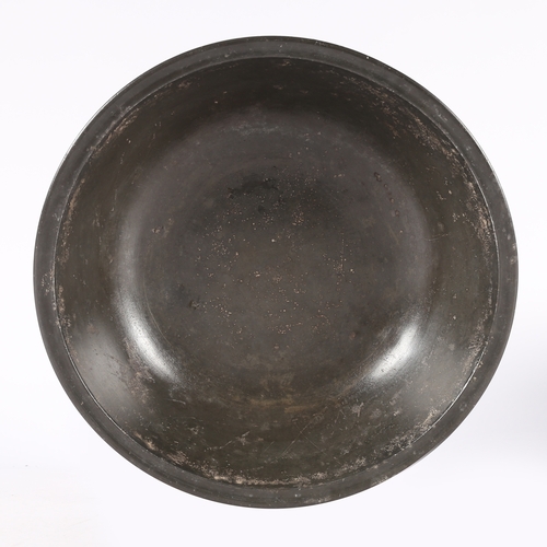 124 - A PEWTER NARROW RIM DEEP BOWL OR BASIN, PROBABLY GLASGOW. With steep booge and flat base, diameter 2... 