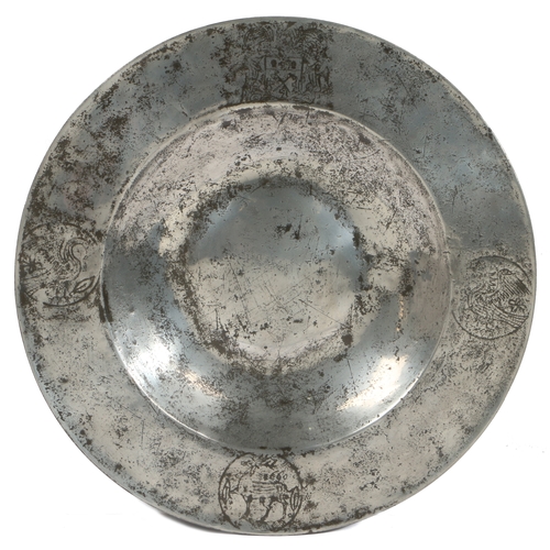 142 - A FINE AND RARE CHARLES II PEWTER BROAD RIM AND BOSSED DISH, ENGRAVED WITH THE ARMS OF THE WORSHIPFU... 