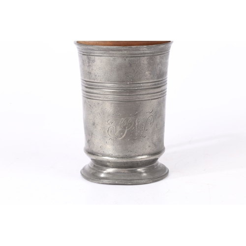 153 - AN EARLY 19TH CENTURY LIGNUM VITAE 'FORMER OR JACK AND A PEWTER QUART MUG. The straight-sided mug w... 