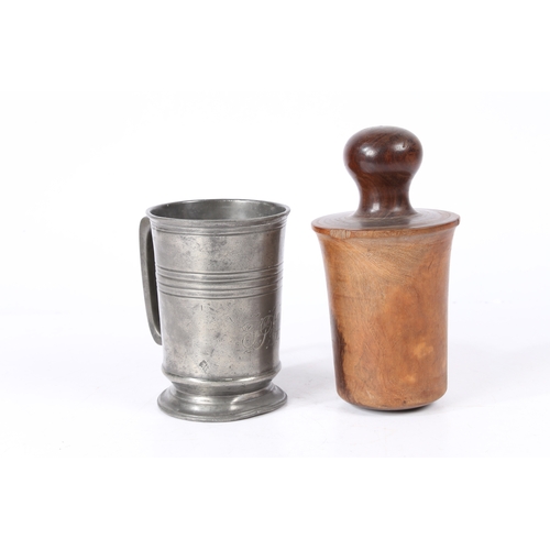 153 - AN EARLY 19TH CENTURY LIGNUM VITAE 'FORMER OR JACK AND A PEWTER QUART MUG. The straight-sided mug w... 