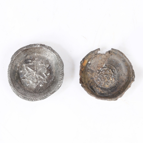 156 - TWO PEWTER TOY BOWLS, ENGLISH, CIRCA 1600-50. Each centred with a cast flowerhead, one recovered fro... 