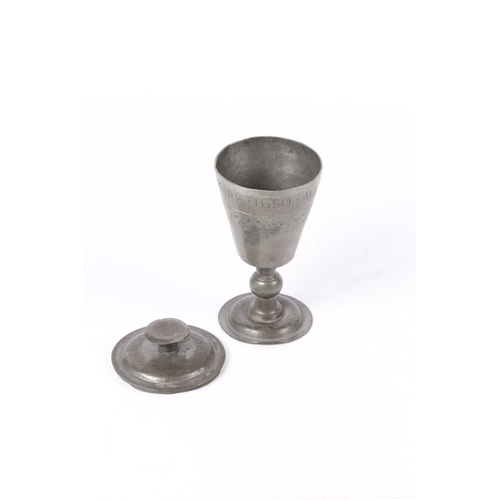 157 - A 17TH CENTURY PEWTER COMMUNION CUP AND COVER, DATED 1650. having a bucket shape body above a ball k... 