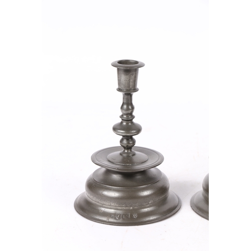 158 - A PAIR OF PEWTER LOW BELL CANDLESTICKS, IN THE 17TH CENTURY BRASS NUREMBERG MANNER. Each baluster ... 