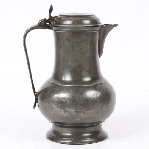 159 - A PEWTER SPOUTED DOMED-LIDDED BULBOUS FLAGON, POSSIBLY ENGLISH, CIRCA 1700. Having a pear-shaped bod... 