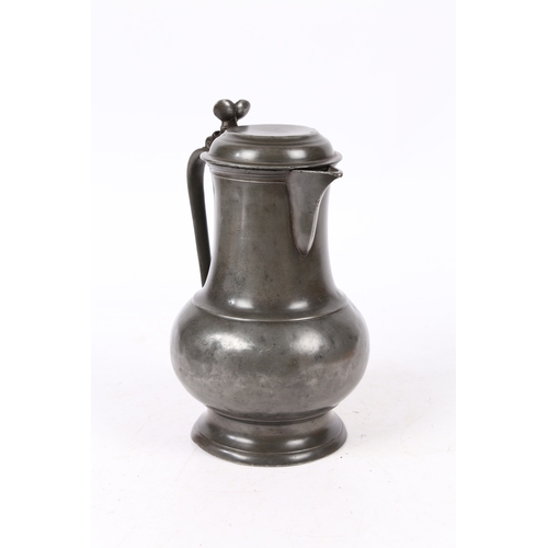 159 - A PEWTER SPOUTED DOMED-LIDDED BULBOUS FLAGON, POSSIBLY ENGLISH, CIRCA 1700. Having a pear-shaped bod... 