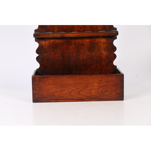 16 - A GEORGE III OAK SPOON RACK, CIRCA 1800. The one-piece back board with arch-shaped cresting and ogee... 