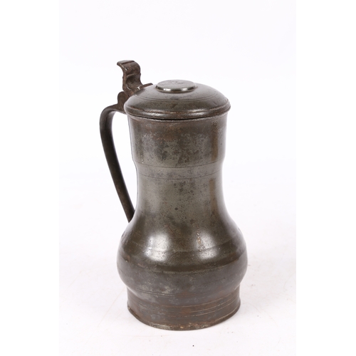 160 - A REMBRANDT' PEWTER FLAGON, DUTCH, CIRCA 1700. The top of the domed-lid with a crowned rose makers... 