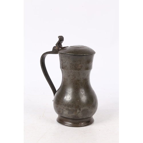 162 - A REMBRANDT PEWTER FLAGON, DUTCH, CIRCA 1700. The top of the domed-lid with three initials and maker... 