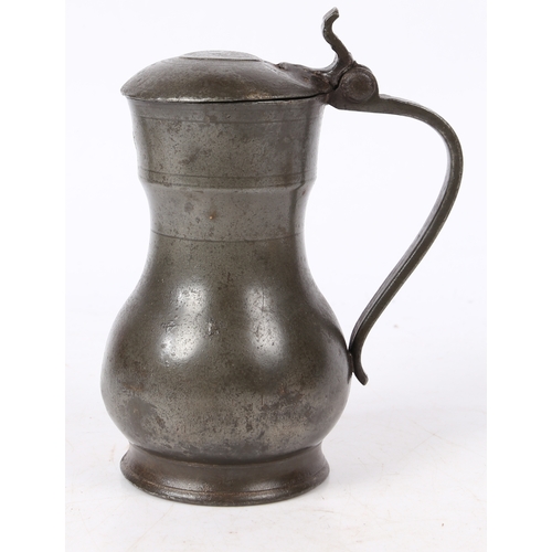 162 - A REMBRANDT PEWTER FLAGON, DUTCH, CIRCA 1700. The top of the domed-lid with three initials and maker... 