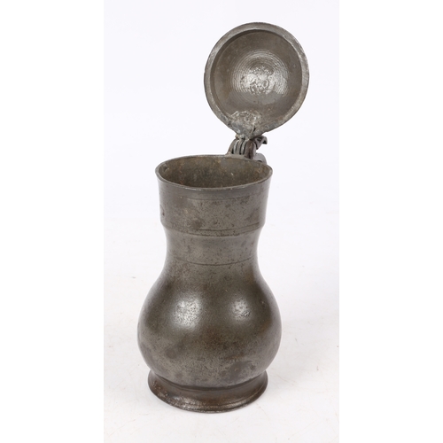 162 - A REMBRANDT PEWTER FLAGON, DUTCH, CIRCA 1700. The top of the domed-lid with three initials and maker... 