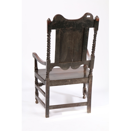 163 - A CHARLES II PANEL-BACK OPEN ARMCHAIR, YORKSHIRE, CIRCA 1670. Having a part open and fielded panel b... 