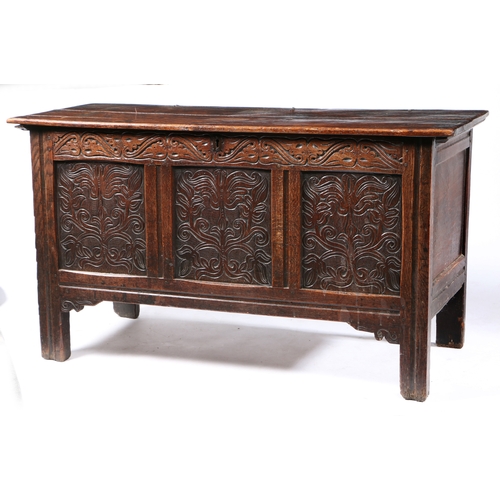 165 - A CHARLES II OAK COFFER, WEST COUNTRY. CIRCA 1670. Having a twin boarded top, the front of three pan... 