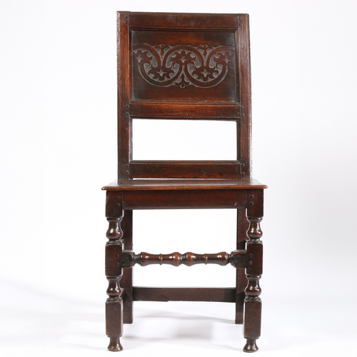 167 - A CHARLES II OAK BACKSTOOL, NORTH COUNTRY, CIRCA 1670. Having a stylized leafy-lunette carved back p... 