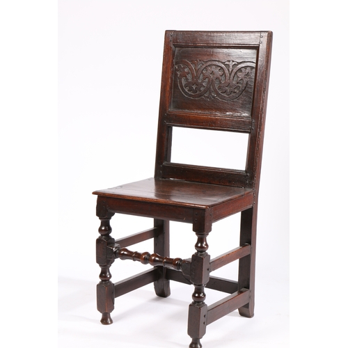 167 - A CHARLES II OAK BACKSTOOL, NORTH COUNTRY, CIRCA 1670. Having a stylized leafy-lunette carved back p... 