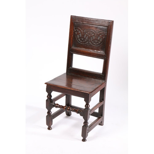 167 - A CHARLES II OAK BACKSTOOL, NORTH COUNTRY, CIRCA 1670. Having a stylized leafy-lunette carved back p... 