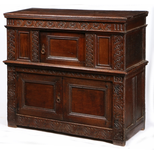 168 - A RARE AND SMALL CHARLES I OAK LIVERY CUPBOARD, WEST COUNTRY, POSSIBLY EXETER, CIRCA 1630. Having a ... 