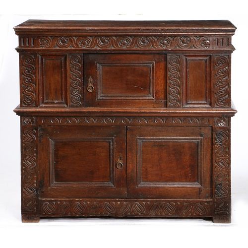 168 - A RARE AND SMALL CHARLES I OAK LIVERY CUPBOARD, WEST COUNTRY, POSSIBLY EXETER, CIRCA 1630. Having a ... 