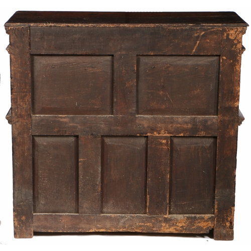 168 - A RARE AND SMALL CHARLES I OAK LIVERY CUPBOARD, WEST COUNTRY, POSSIBLY EXETER, CIRCA 1630. Having a ... 