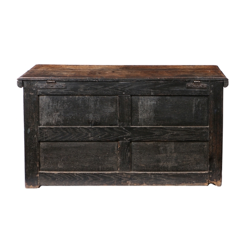 169 - AN 18TH CENTURY OAK CHEST. the rectangular top above three locks and four panels to the front, 136cm... 